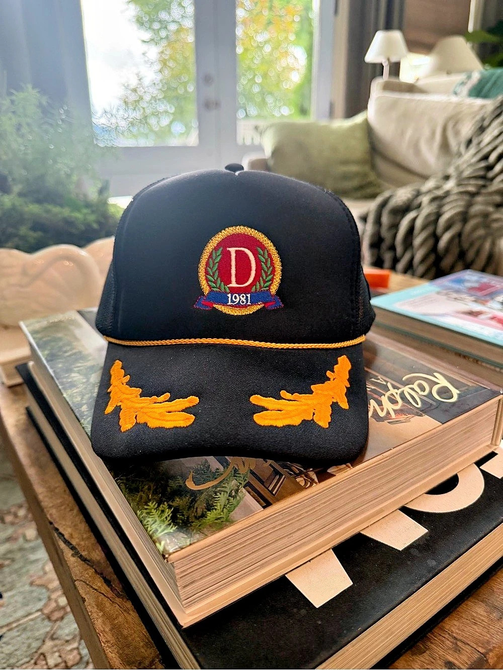 Danzy Embroidered Trucker Hat in Black & Orange Like New
